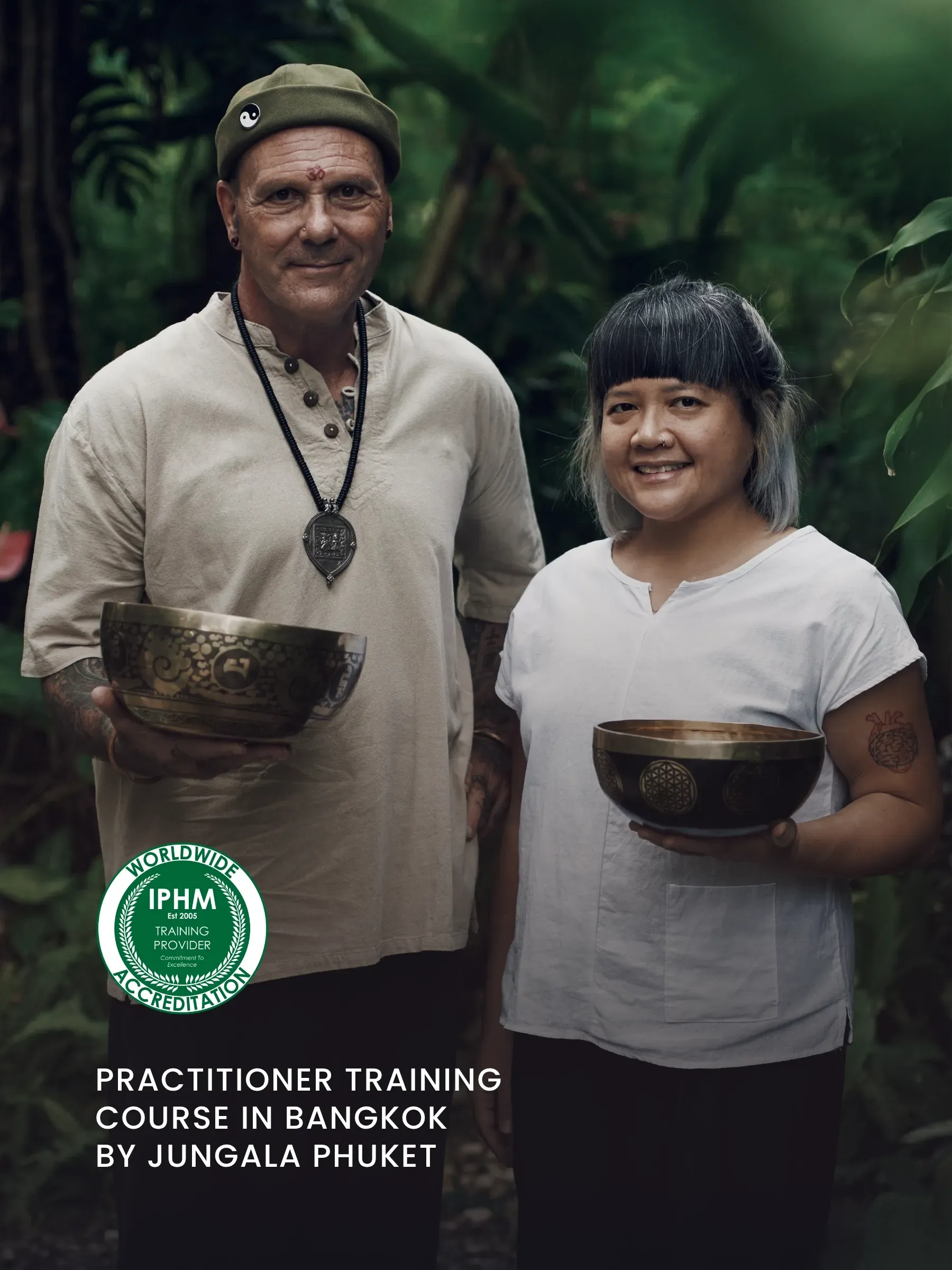 Jungala Phuket's lead teachers holding Himalayan singing bowls.